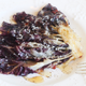 Waffled radicchio on a white plate with parmesan